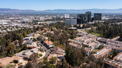 Daytime aerial skyline view of the Woodland Hills area of Los Angeles, California, USA. - obrazy, fototapety, plakaty