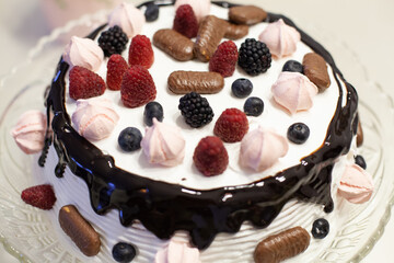 Tasty birthday fruit cake with chocolate.