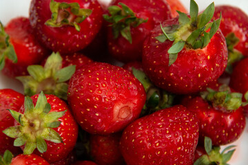 Fresh ripe strawberries close-up. Fresh ripe strawberry texture. Strawberry harvest.