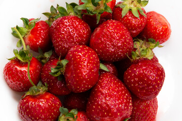 Fresh ripe strawberries. Close-up. Strawberry harvest. White background.