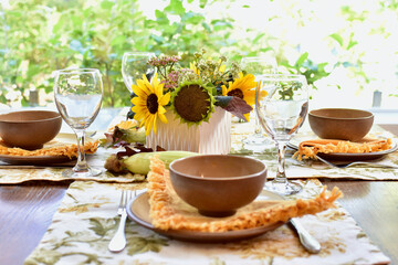 Autumn Thanksgiving table decor and place settings for festive family dinner, home life interior background. Copy space, house and home background, living
