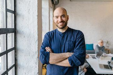 Portrait of a cheerful young businessman in the office