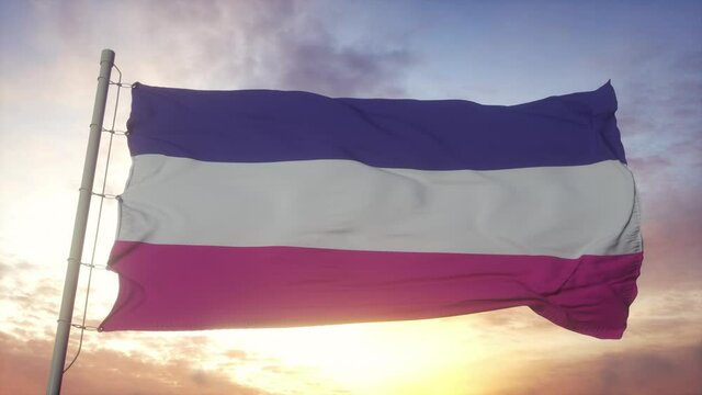 Heterosexual pride flag waving in the wind, sky and sun background