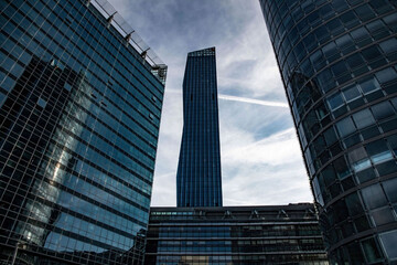 Fototapeta premium skyscraper silhouettes at the modern part of Vienna called Danube city in a low angle view