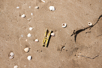 plastic trash on the beach sand