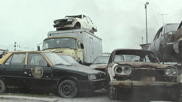 Cars and Wrecked Taxi Cab in a Car Cemetery in the Outskirts of Buenos Aires, Argentina.  