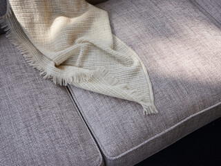 Light plaid on gray couch