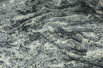 Rock texture. Background surface of the stone. Rocky hard rock.