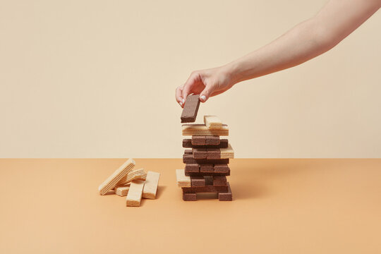 Woman building waffles tower