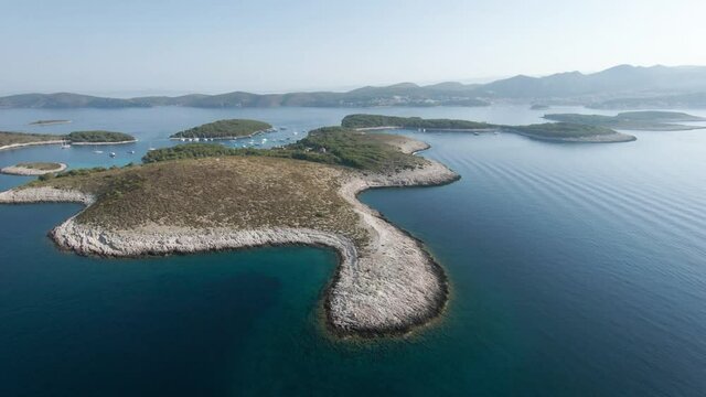 Aerial drone shot, Croatia island, bays with boats, town Hvar in the background