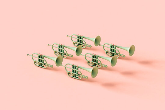 Green trumpets on pink background with copyspace