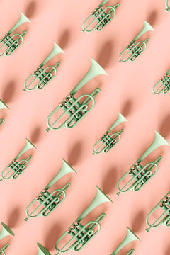Green trumpets on pink background
