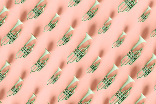 pattern of Green trumpets on pink background