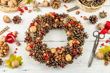Autumn wreath of cones, nuts, and berries. Assortment from natural materials