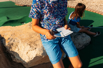 Person keeping track of score. 