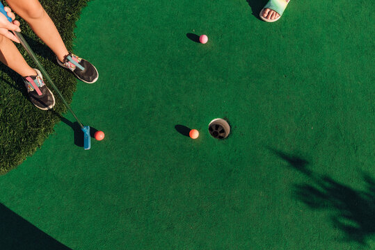 Putters on the fairway at the golf course. 