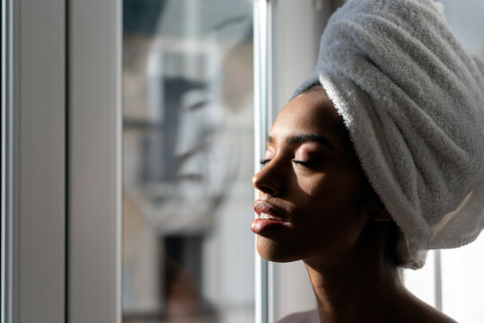 Beautiful black woman wrapped in a towel