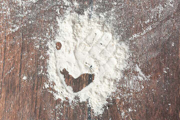 handprint on flour. baby hand