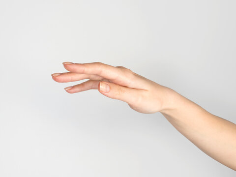 Female hand on empty white background