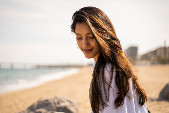 Portrait of serene young woman at beach