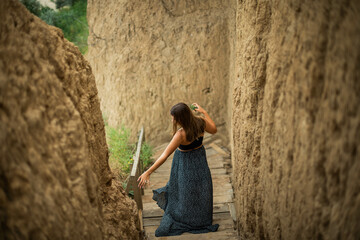 cheerful young girl spending good time at the beach. Beauty portrait. Сute teenage girl or woman on the beach nature landscape fresh air beach. Natural beauty. lifestyle/ real people/ funny/ dance.