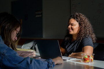 two students studying in the library