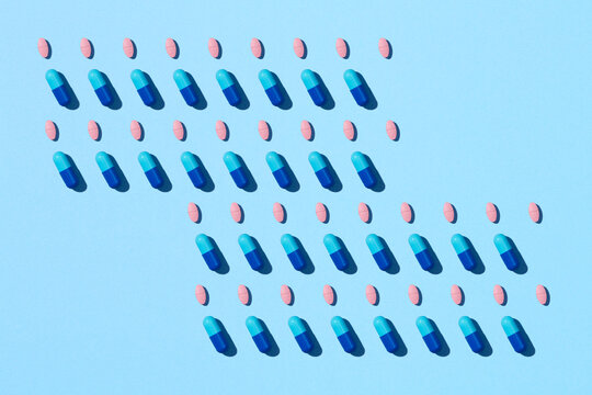Different colored pills with pharmaceutical concept