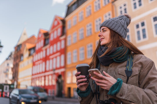 Woman using smartphone outdoors.