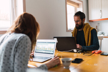 Two journalist working in office