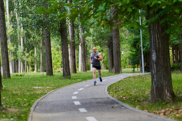 Fototapeta premium Marathon runner training in the park