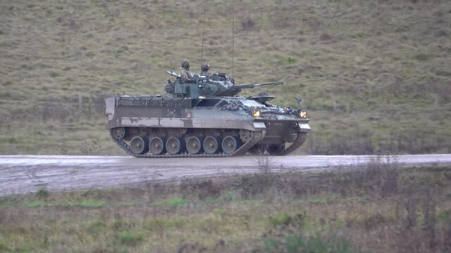 British army Warrior FV510 infantry fighting vehicle in action on military exercise, Salisbury Plain UK