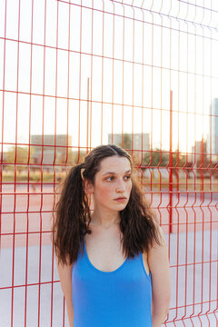 young woman in retro sports outfit goes in for sports
