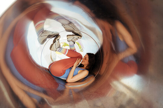 Cheerful sporty woman inside tube