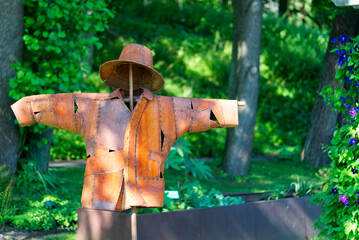 made of metall scarecrow on a sunny day close up