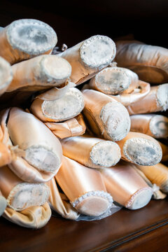 Pile Of Used Ballet Pointe Shoes Of A Ballerina.