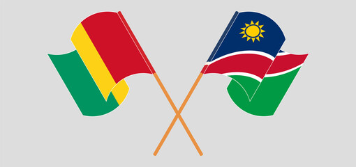 Crossed and waving flags of Guinea and Namibia