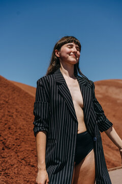 Woman Wearing Blazer and Nude Underneath In Desert