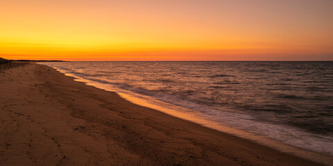 Tranquil beach seascape at sunrise on South Cape Beach in Mashpee, Massachusetts