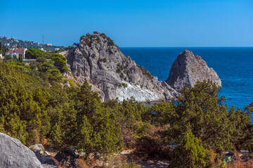 Rock Diva on beach, beautiful black sea shore landscape with mountain cliff, main nature landmark in Crimean Simeiz village