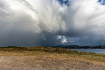Naklejka na ściany i meble Evolution of the storm on the Cantabrian coast until the spectacular multicolored sunset!