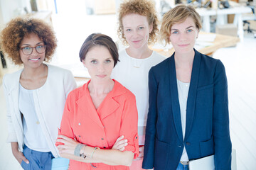 Portrait of women smiling in office