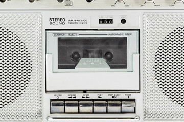 Macro detail of vintage stereo boom box cassette player.