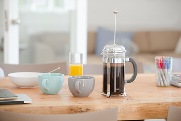Cups and tea on table in office