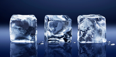 Three natural ice cubes lying in a row isolated on a dark blue background.