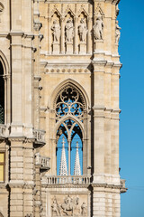 Detail of windows and towers of the Vienna city hall building with neo-gothic architectural style