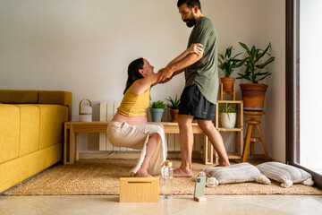 couple doing home birth preparation exercises