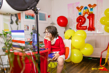 Bored boy watching elementary school graduation online