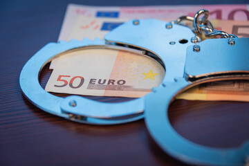 Handcuffs and euros, crime and bribes.