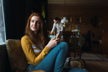 Woman using smartphone in office