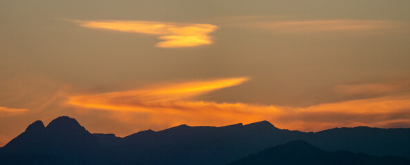 A sunset with the silhouette of the Pedraforca, a famous mountain in Catalonia.
